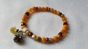 Dzeltena ahāta rokassprādze 18.5 cm, bumbiņa ir 7mm.